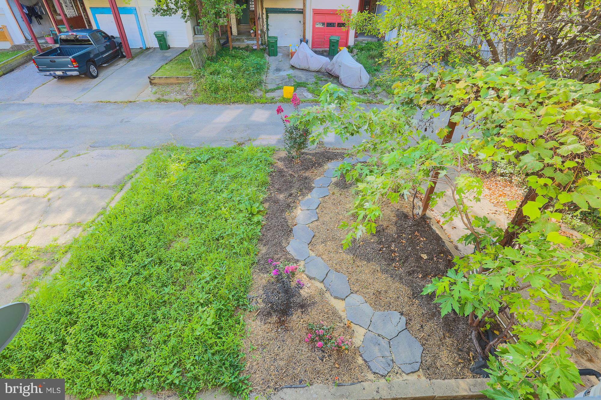 3628 Rexmere Road Baltimore, MD 21218 - Photo 24 of 28 a backyard of a house with a yard and outdoor seating