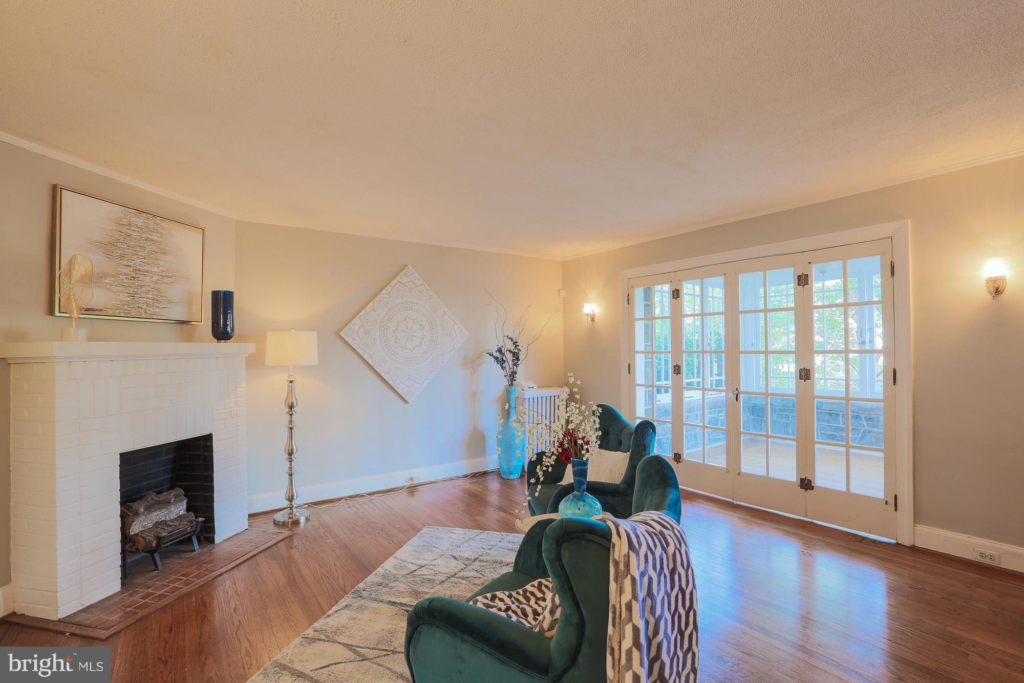 3628 Rexmere Road Baltimore, MD 21218 - Photo 6 of 28 a living room with furniture and a fireplace