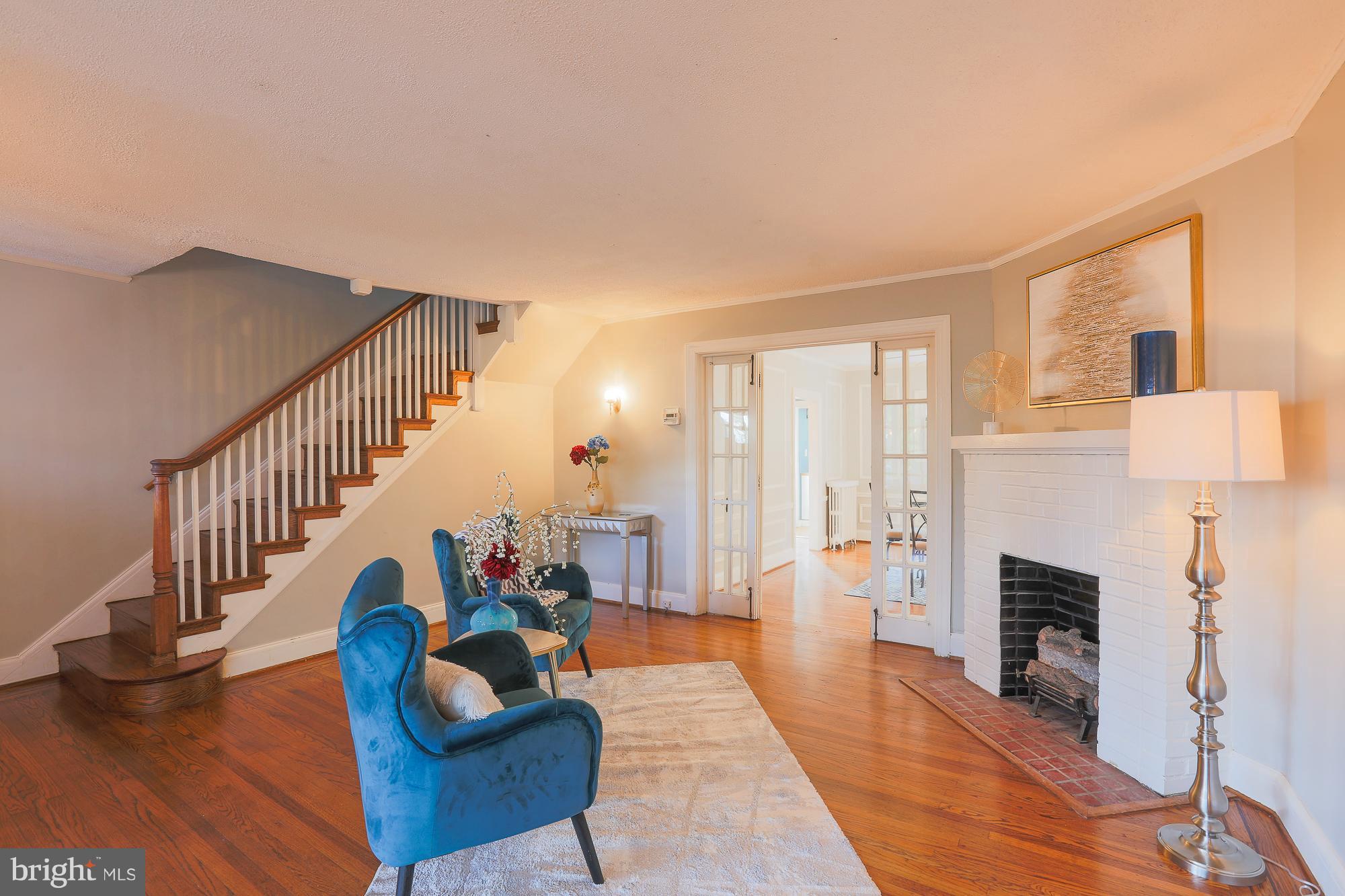 3628 Rexmere Road Baltimore, MD 21218 - Photo 7 of 28 a living room with furniture and a fireplace