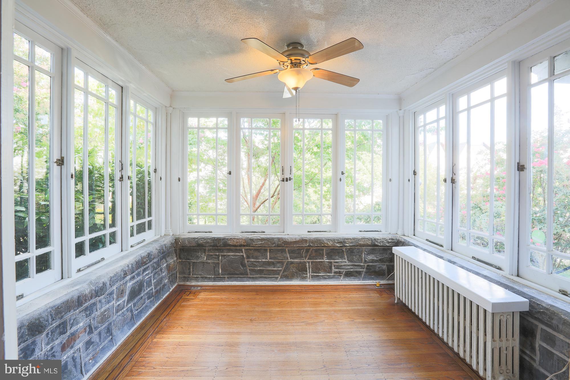 3628 Rexmere Road Baltimore, MD 21218 - Photo 8 of 28 a view of an empty room with wooden floor and a window