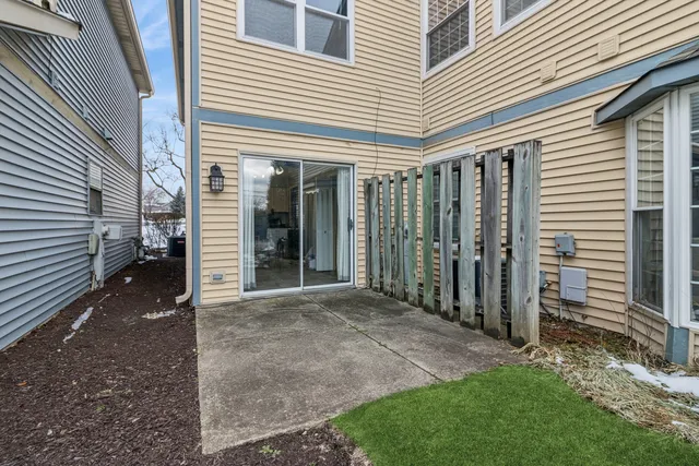 a view of a house with backyard and porch