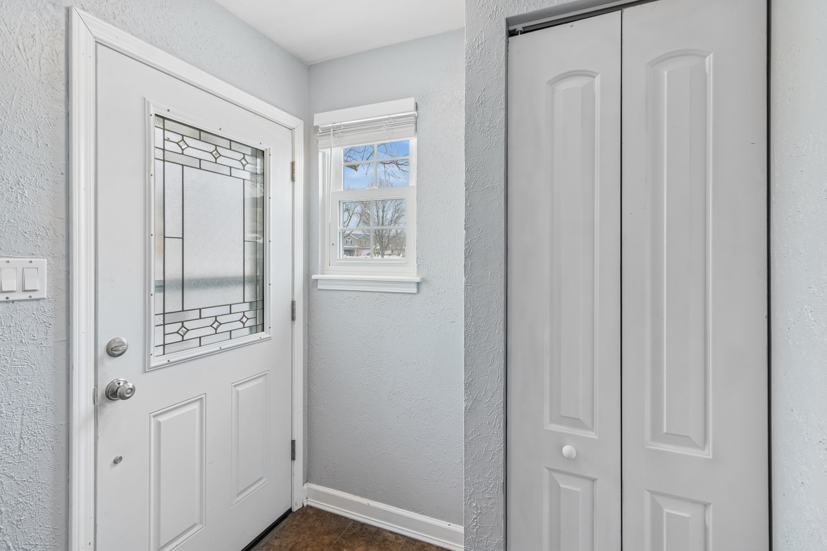 8313 High Point Circle, Unit F Darien, IL 60561 - Photo 3 of 20 a view of a hallway with windows and entryway