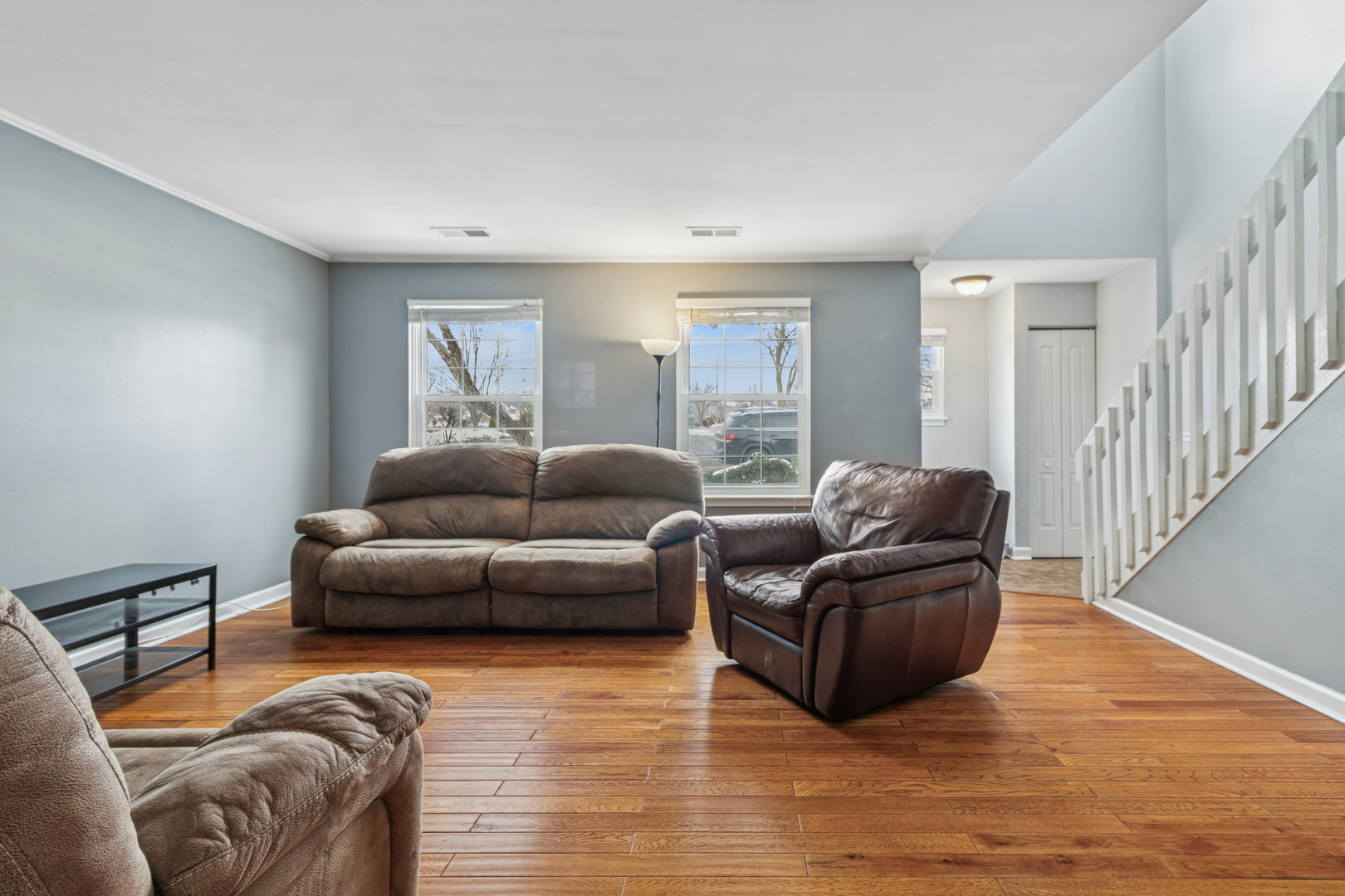 8313 High Point Circle, Unit F Darien, IL 60561 - Photo 7 of 20 a living room with furniture and a wooden floor