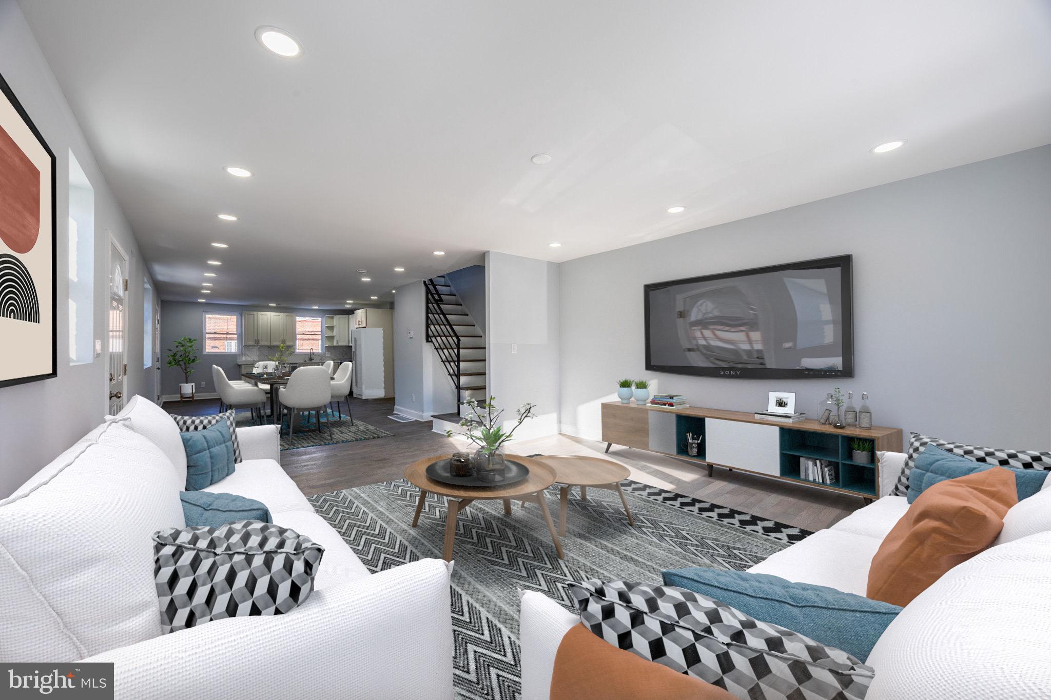 a living room with furniture and a flat screen tv