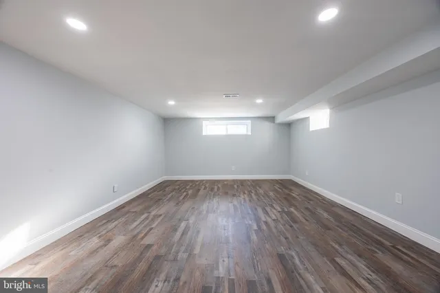 a view of an empty room and wooden floor