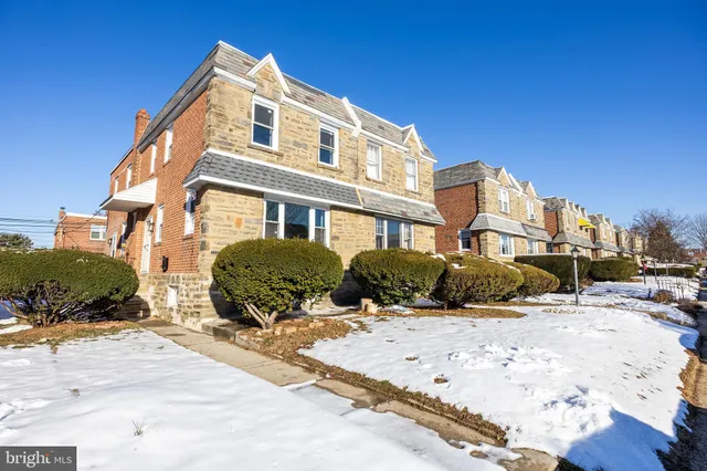 a front view of a building with snow