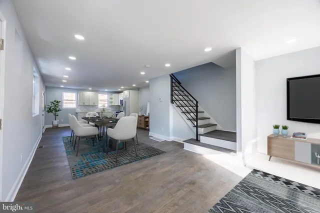 a view of a living room and dining room