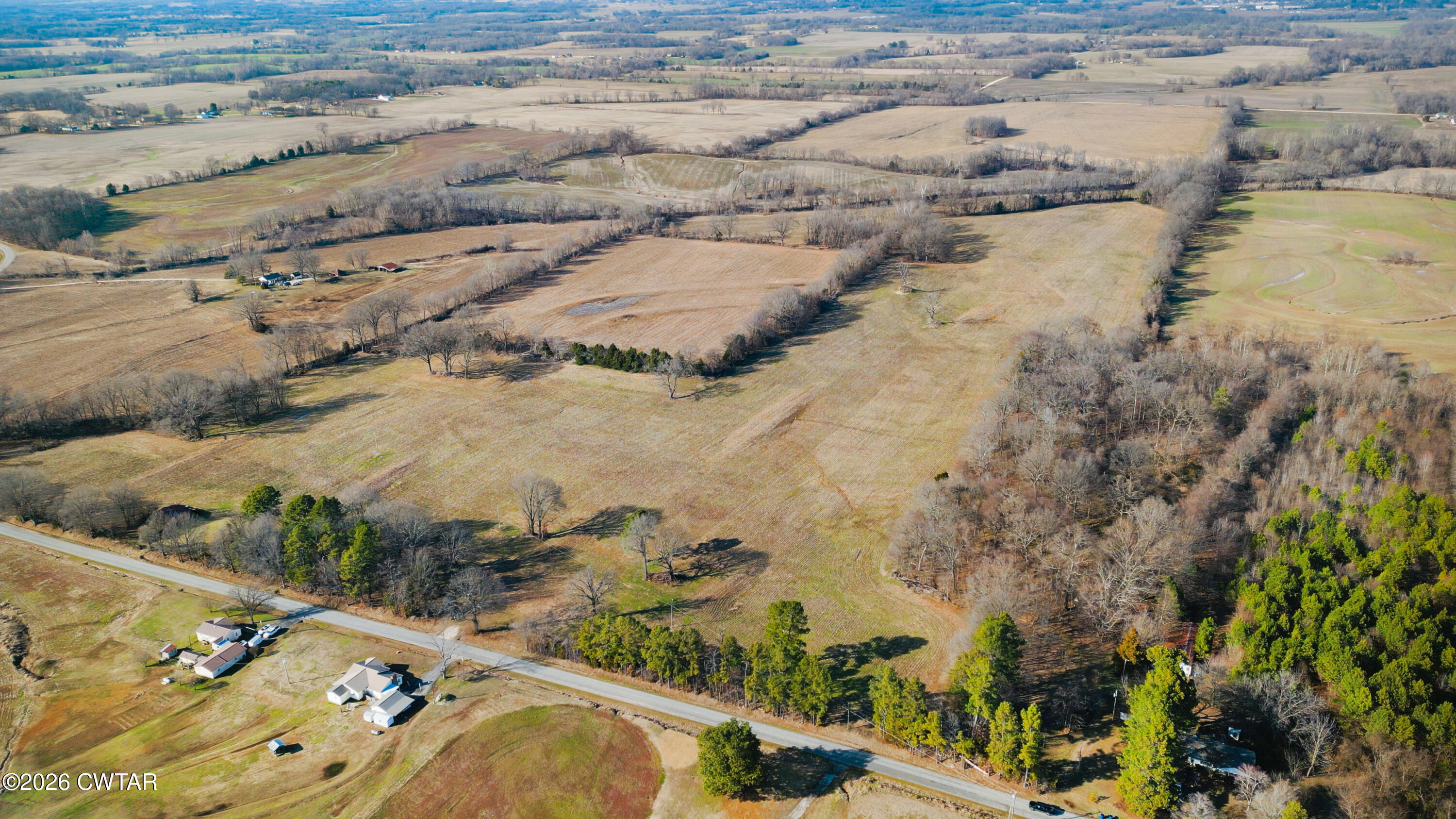 180 Brazil Fruitland Road Humboldt, TN 38343 - Photo 4 of 26 an aerial view of residential houses with outdoor space