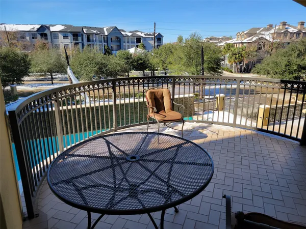 a view of a balcony with chairs