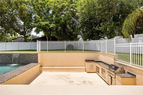 a view of a backyard with swimming pool