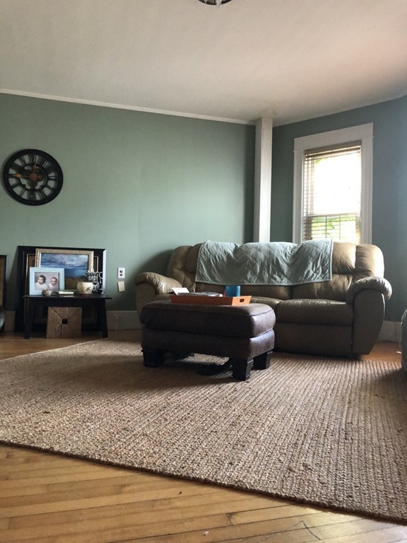 603 Temple Street Whitman, MA 02382 - Photo 6 of 8 a living room with furniture and a couch