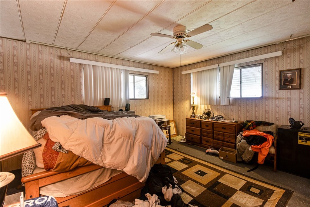 9443 Sharondale Road Calimesa, CA 92320 - Photo 16 of 22 a bedroom with bed and window