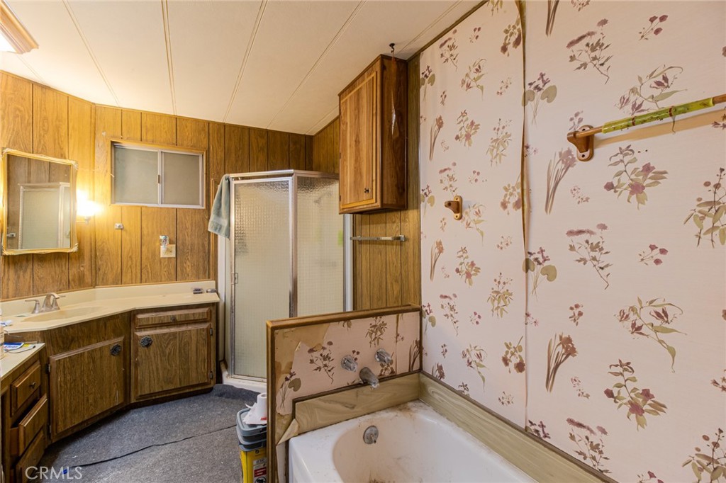 9443 Sharondale Road Calimesa, CA 92320 - Photo 17 of 22 a bathroom with shower sink and mirror