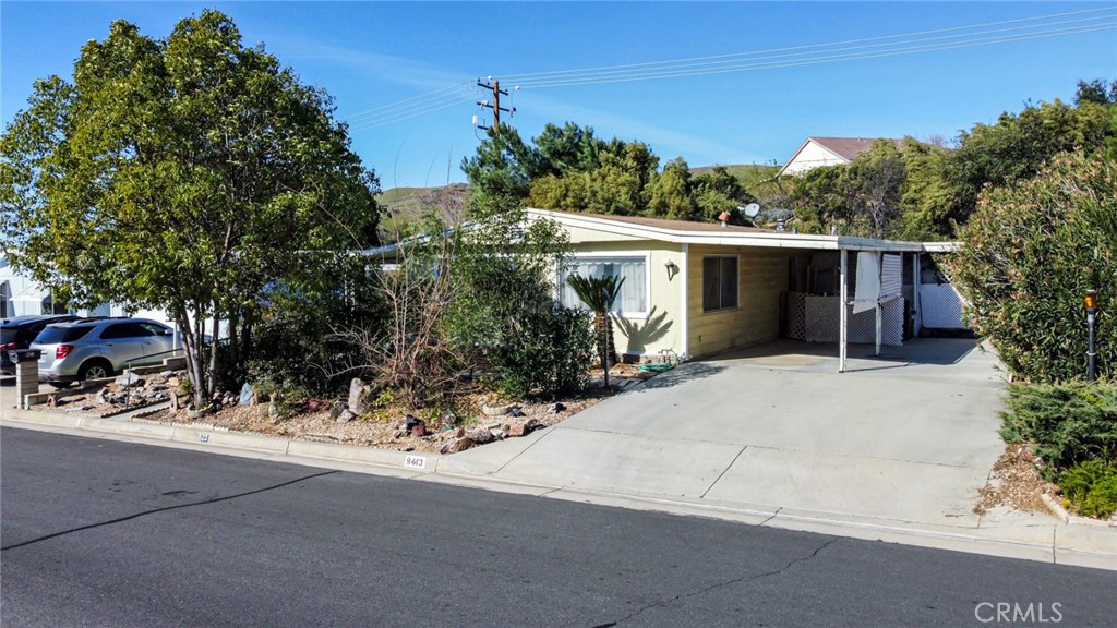 9443 Sharondale Road Calimesa, CA 92320 - Photo 22 of 22 front view of house with potted plants and large trees