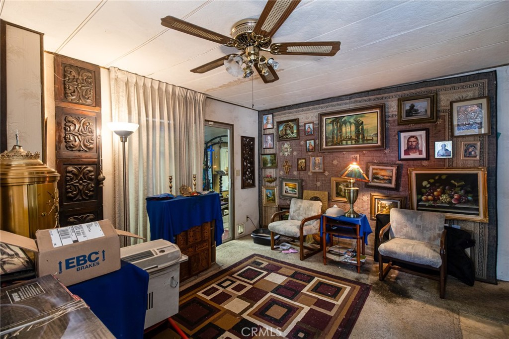 9443 Sharondale Road Calimesa, CA 92320 - Photo 9 of 22 a living room with furniture and a window