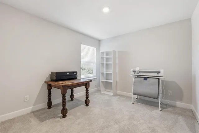 a view of a workspace with furniture