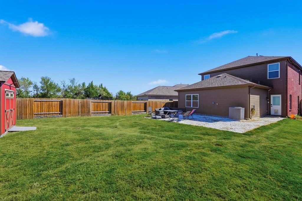 1334 Windemere Way Princeton, TX 75407 - Photo 24 of 31 a view of a house with backyard and porch