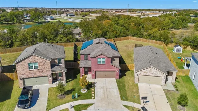 an aerial view of a house with a garden