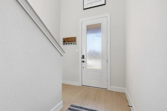 a kitchen with stainless steel appliances granite countertop a sink and a stove