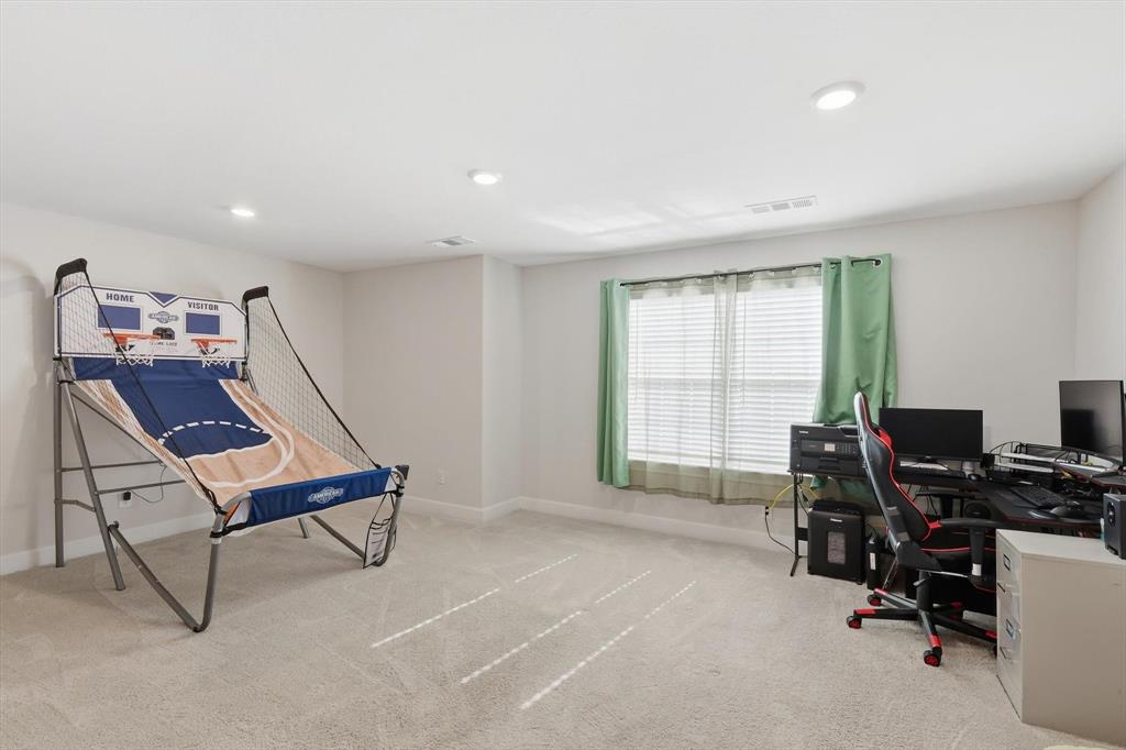 1334 Windemere Way Princeton, TX 75407 - Photo 4 of 31 a view of a workspace with furniture and a window