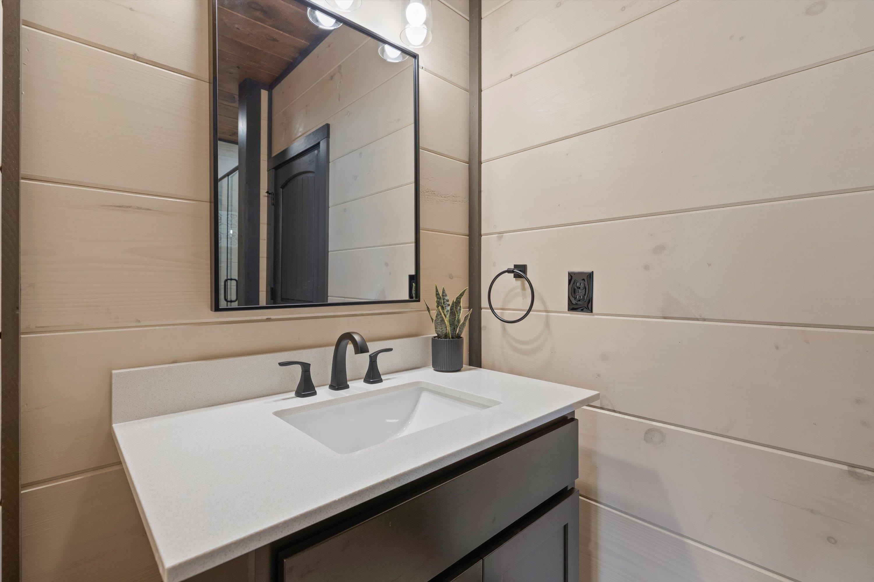 327 Rambling Crk Way, Unit LOT 54R Sevierville, TN 37863 - Photo 17 of 40 a bathroom with a sink and a mirror