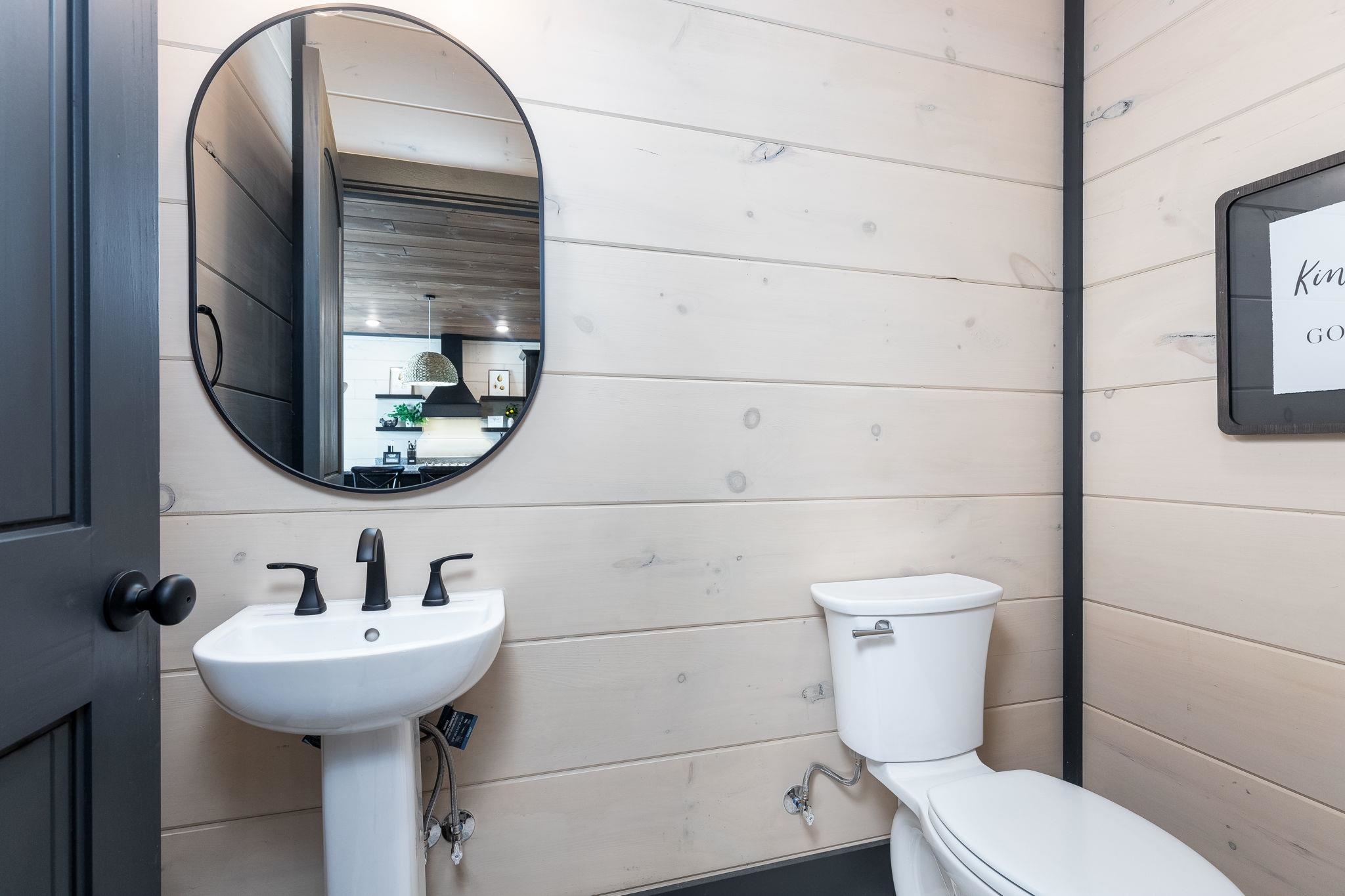 327 Rambling Crk Way, Unit LOT 54R Sevierville, TN 37863 - Photo 18 of 40 a bathroom with a toilet sink and mirror