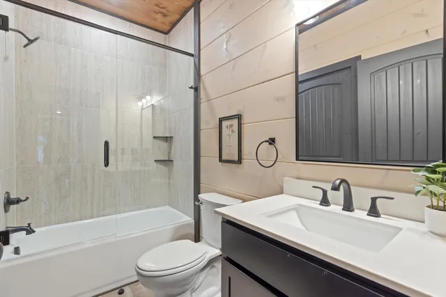 a bathroom with a sink a toilet and a bathtub