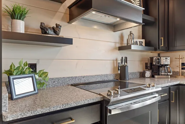 a kitchen with a sink a counter and cabinets