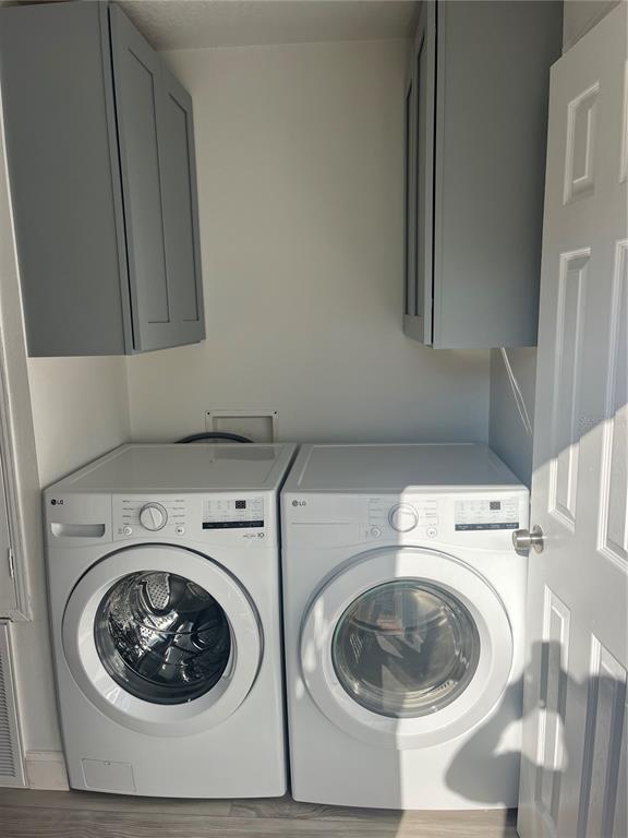 17300 Shady Hills Road Spring Hill, FL 34610 - Photo 5 of 17 a utility room with dryer and washer