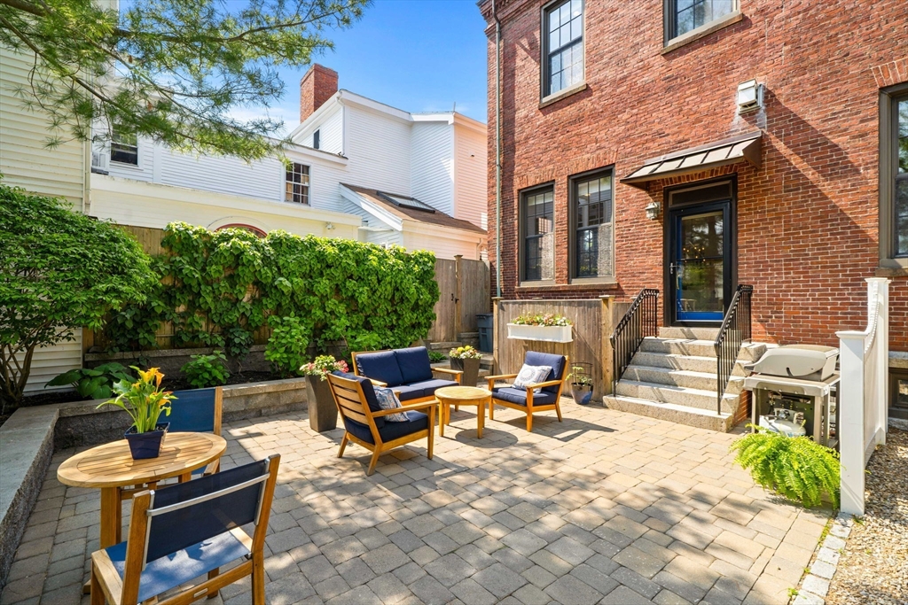 44 Pleasant Street, Unit 1 Marblehead, MA 01945 - Photo 27 of 35 a view of a patio with a table and chairs in patio