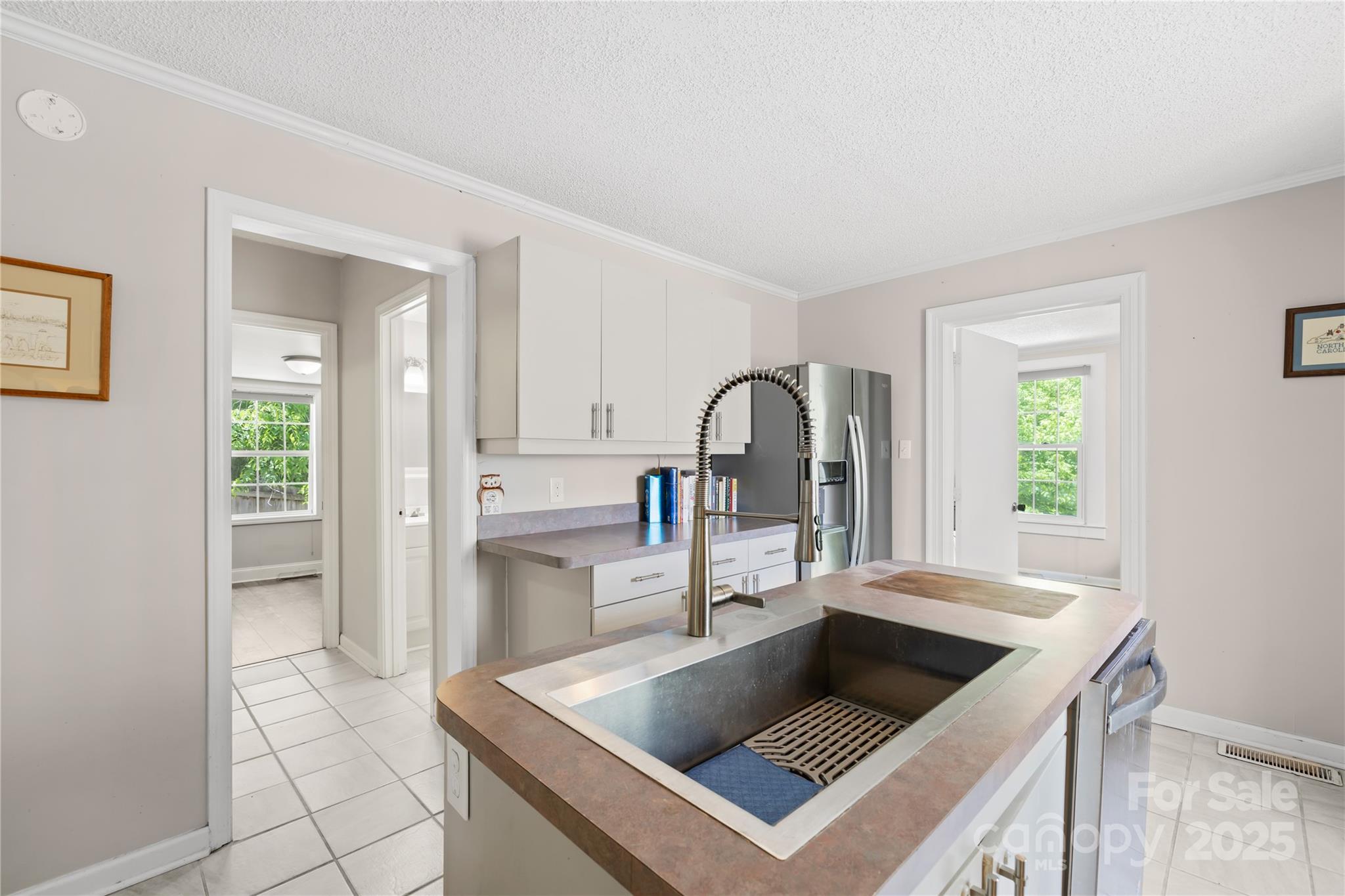 485 Lincoln Street Cramerton, NC 28032 - Photo 4 of 16 a kitchen with a stove and a sink