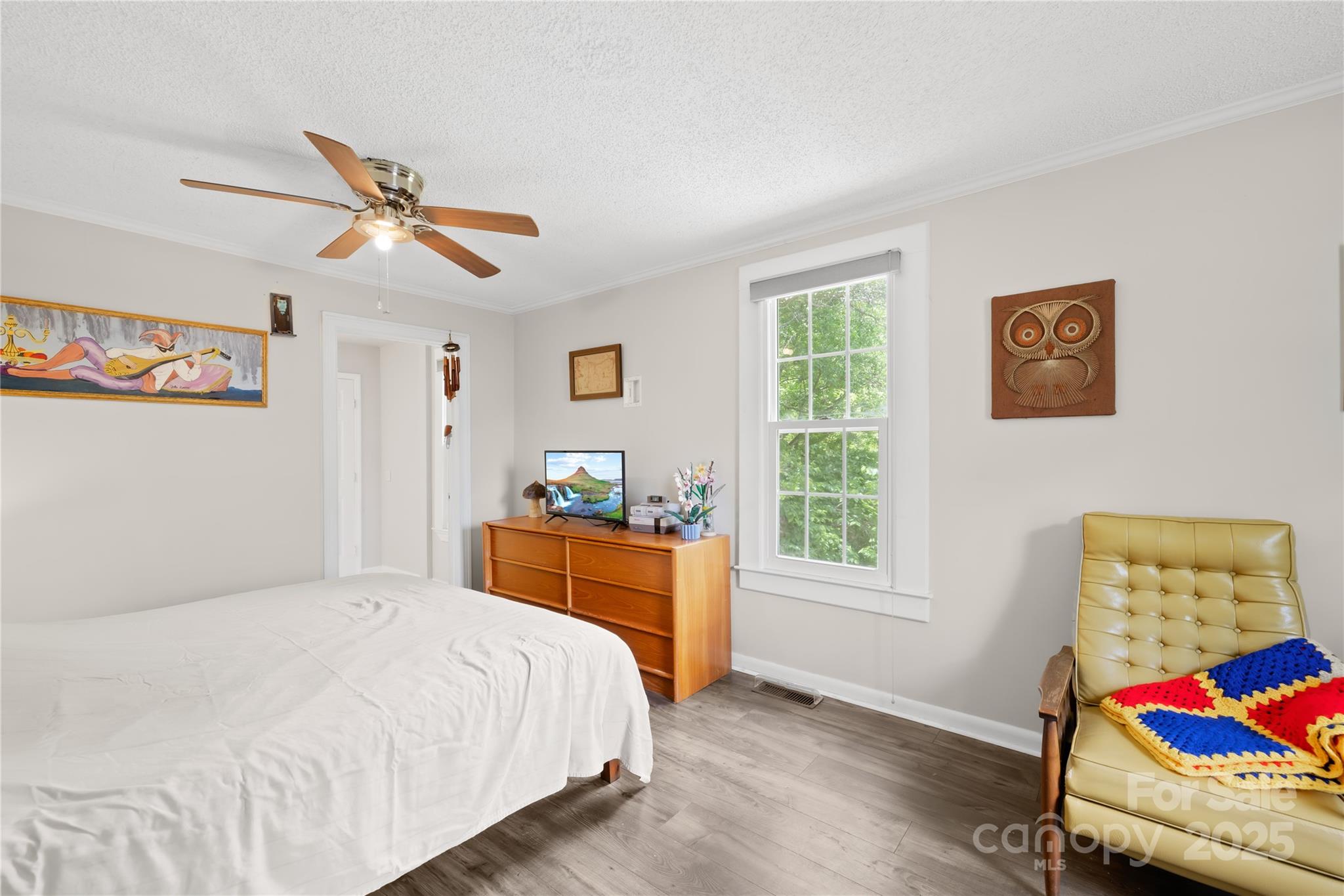 485 Lincoln Street Cramerton, NC 28032 - Photo 6 of 16 a bedroom with a bed and wooden floor