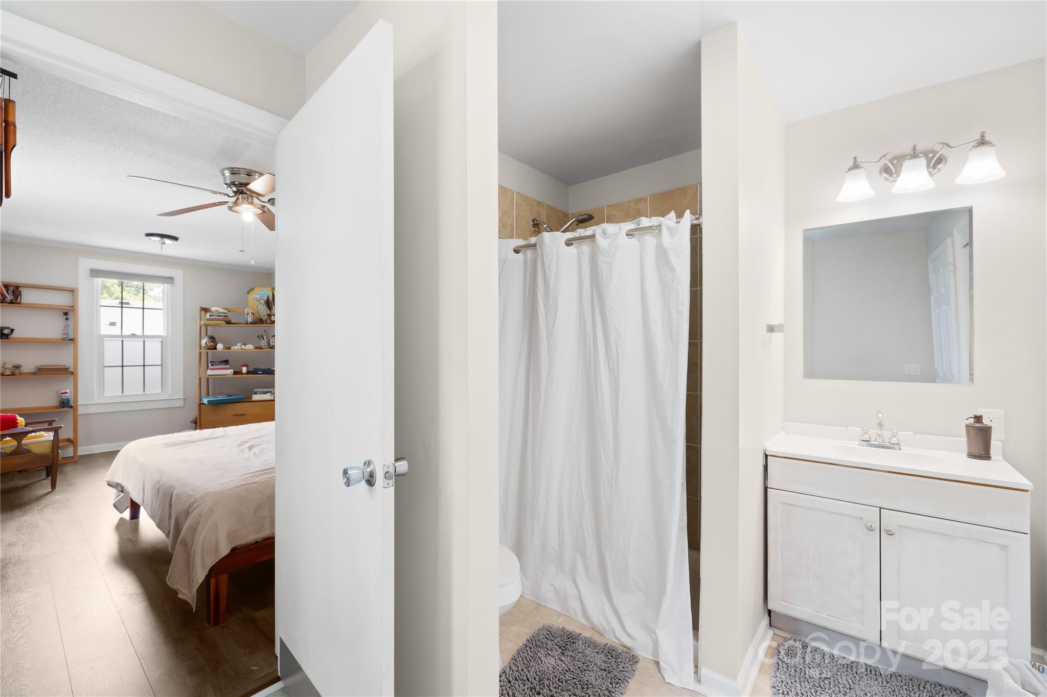 485 Lincoln Street Cramerton, NC 28032 - Photo 7 of 16 a bedroom with a bed and a mirror