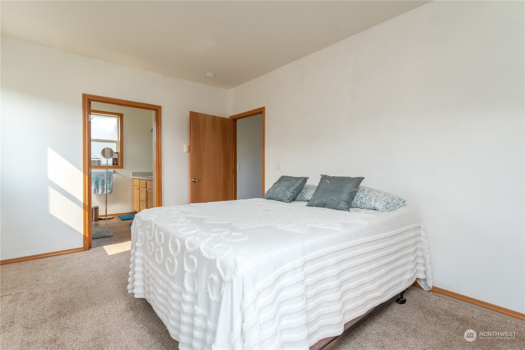 94 Shoemaker Road Manson, WA 98831 - Photo 13 of 37 a bed sitting in a bedroom next to a window