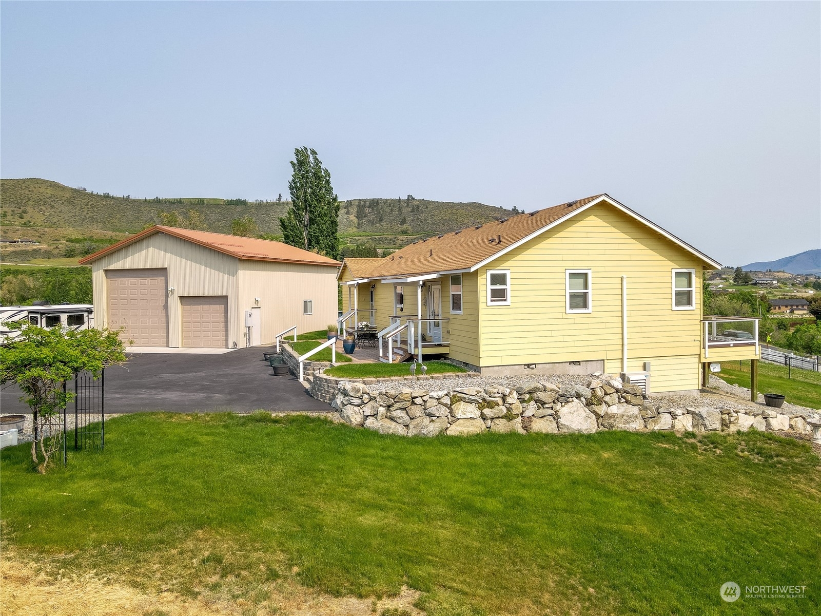 94 Shoemaker Road Manson, WA 98831 - Photo 17 of 37 a front view of house with garden