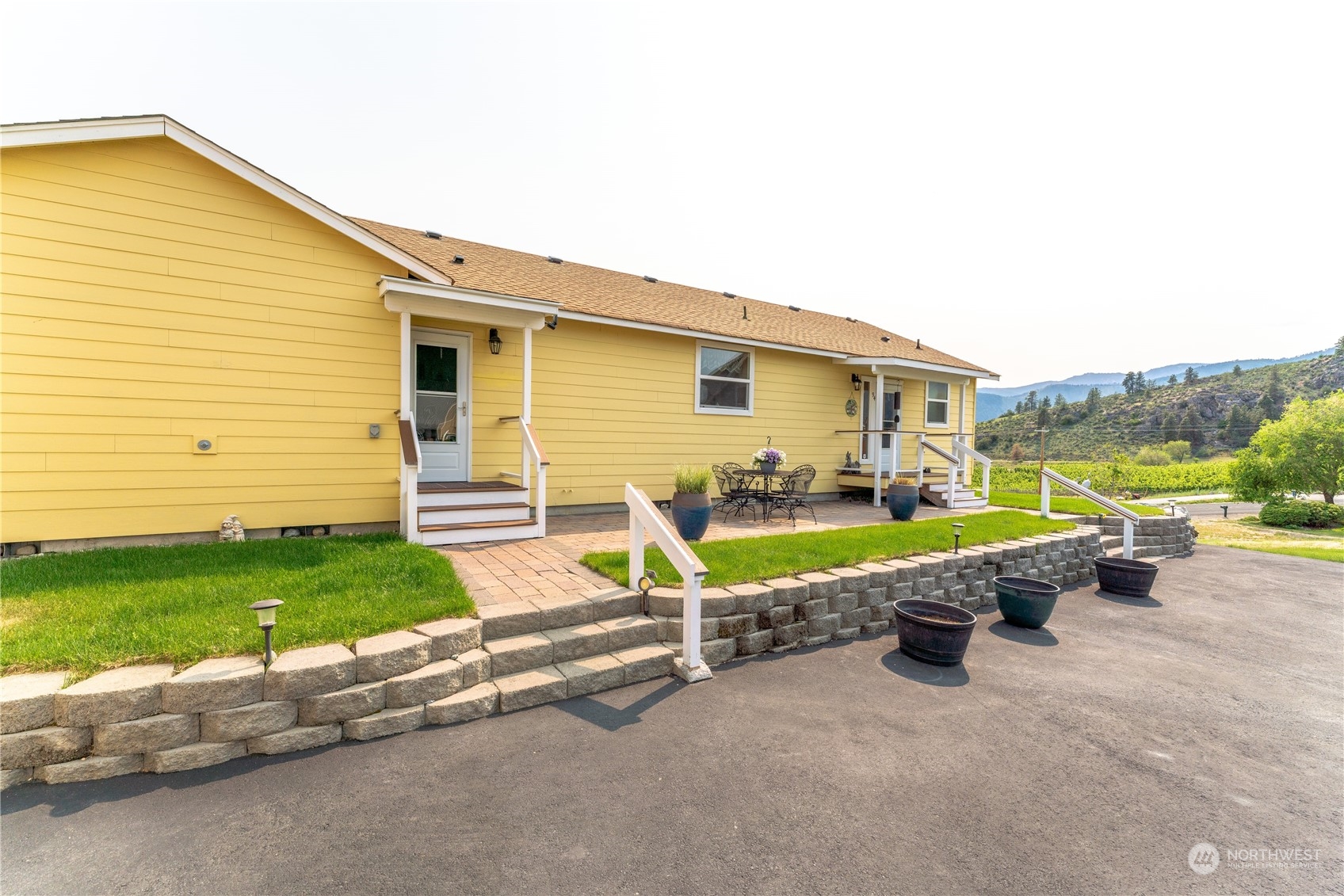 94 Shoemaker Road Manson, WA 98831 - Photo 21 of 37 a view of a house with a backyard and sitting area