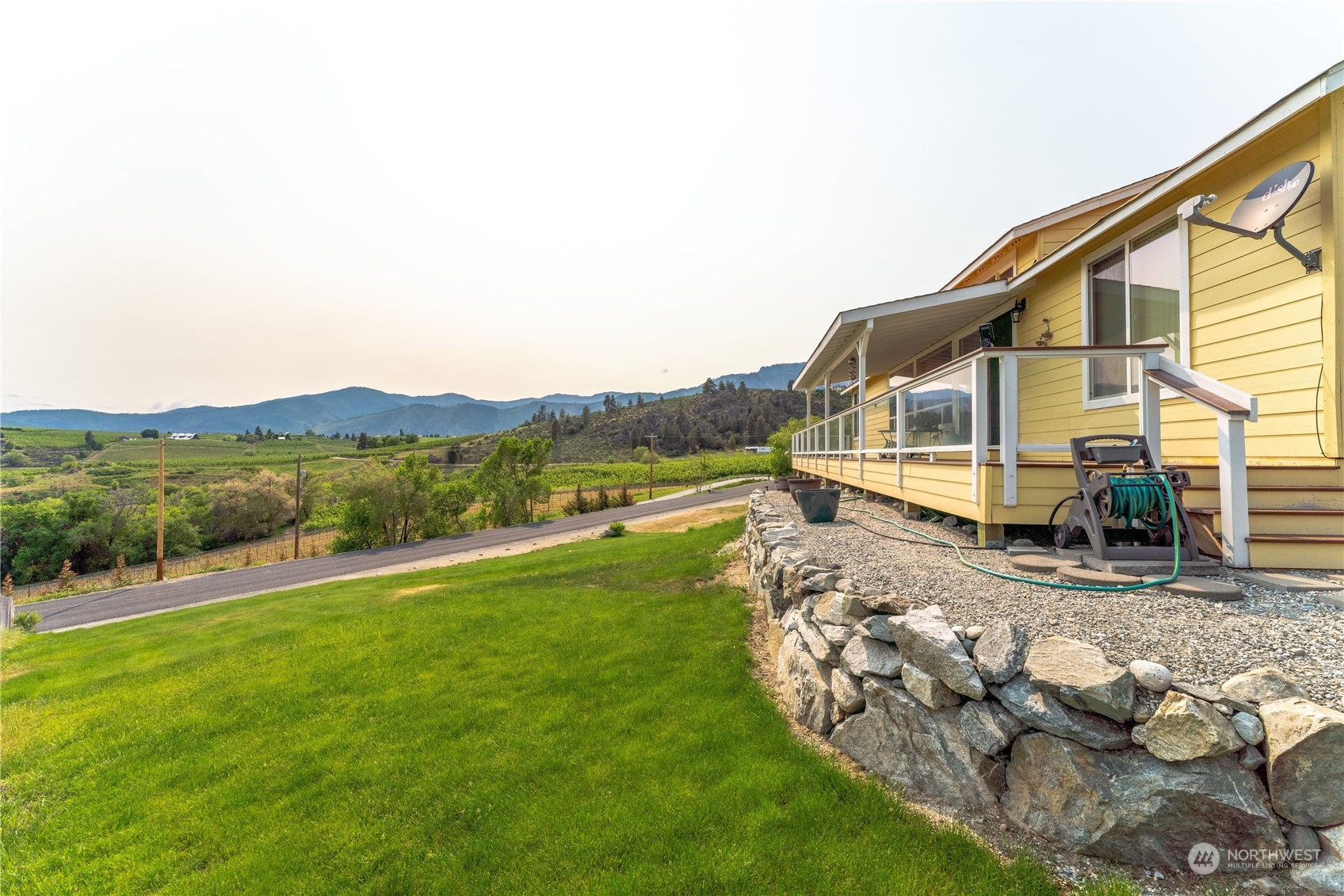 94 Shoemaker Road Manson, WA 98831 - Photo 24 of 37 a view of a house with a yard