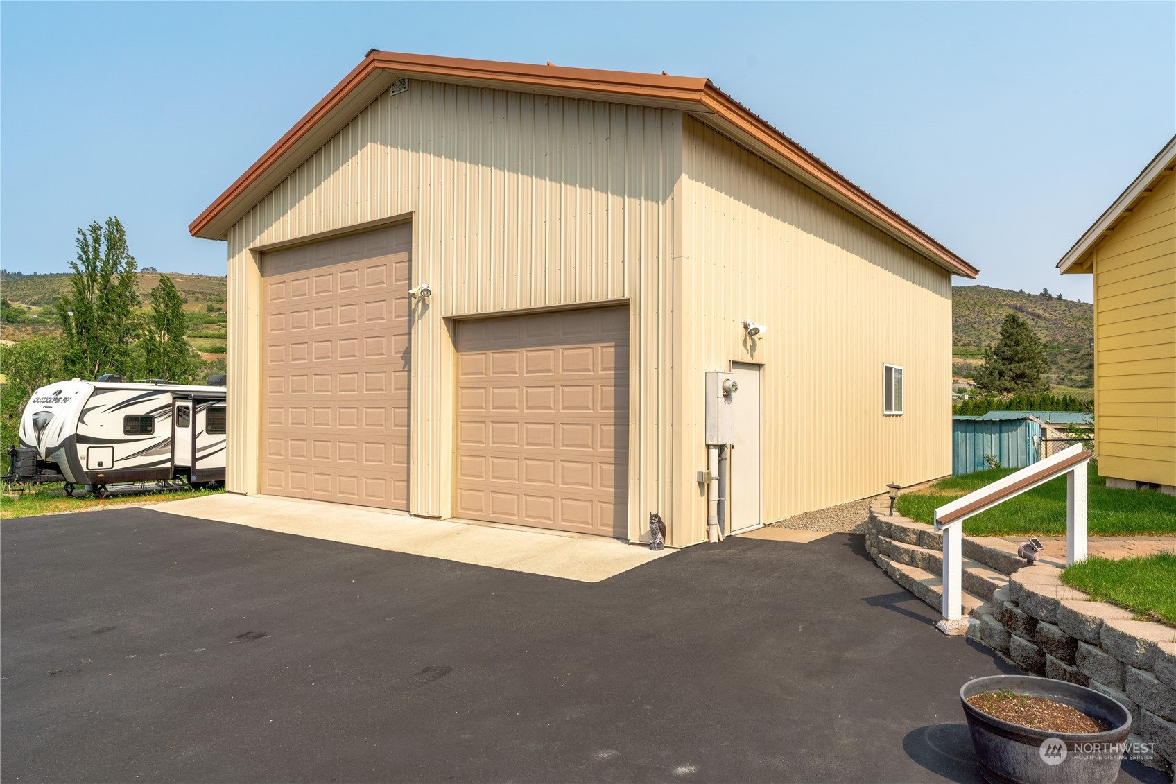 94 Shoemaker Road Manson, WA 98831 - Photo 28 of 37 a view of a house with a patio