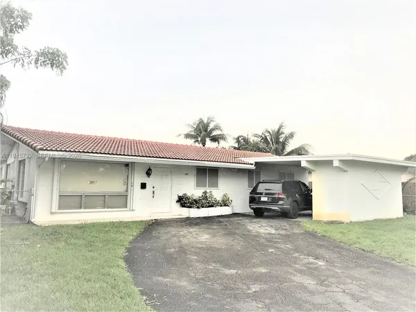 a car parked in front of a house