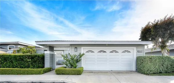 a front view of a house with garage