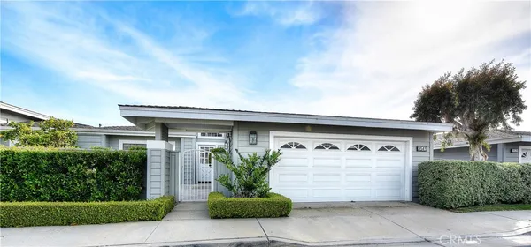 a front view of a house with garage
