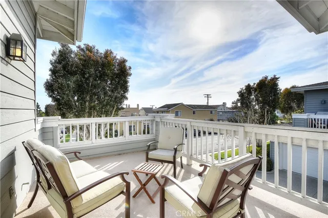 a view of a chair and tables on the roof deck