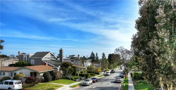 a view of a town with cars parked