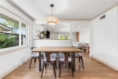 a view of a dining room and a wooden floor