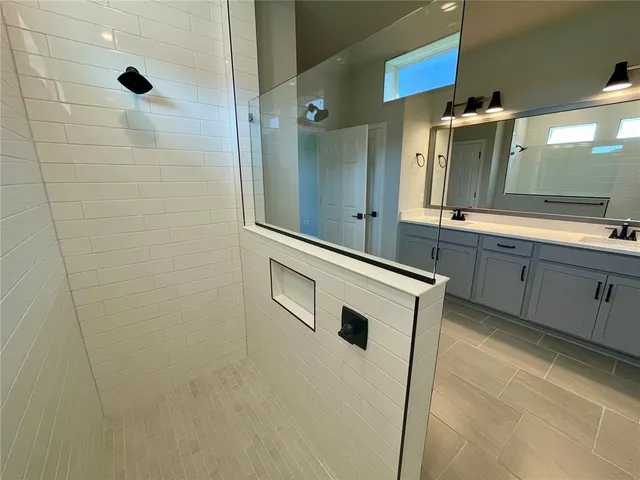 a view of a bathroom with a sink and mirror
