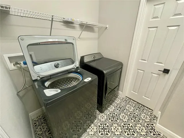 a utility room with dryer and washer