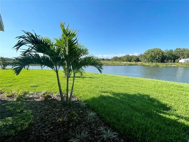a view of a lake with a big yard