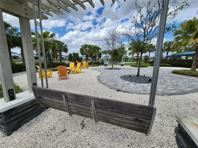 a view of a park with swings and slides