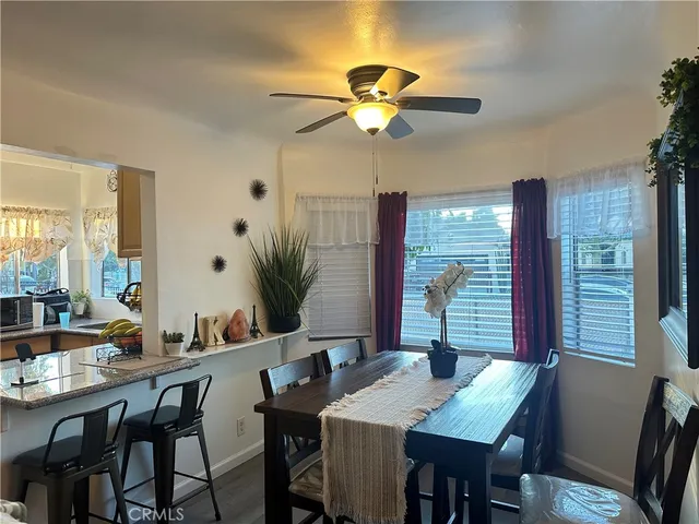 a view of a dining room and a table and chairs