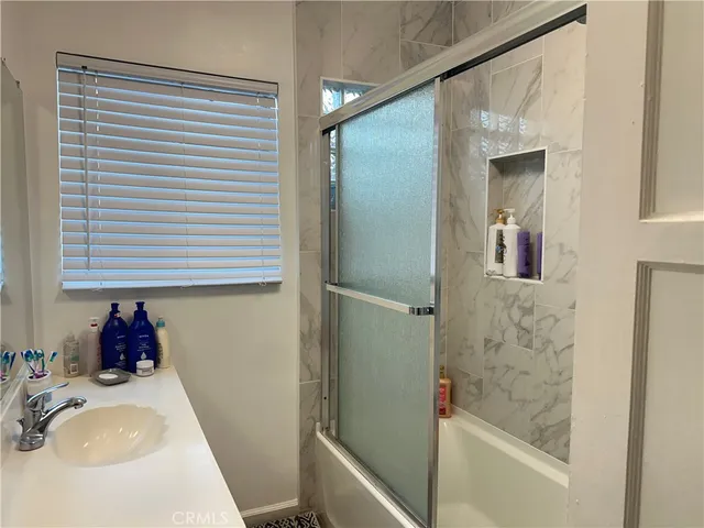a bathroom with a sink and a bathtub